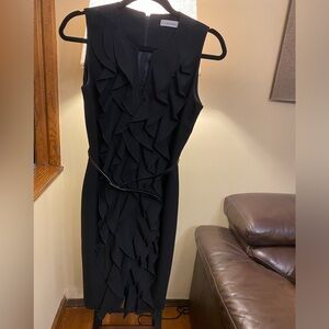 Calvin Klein black dress with ruffles and slim belt at the waist. VGC.